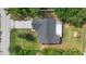 Aerial view of the home showcasing the roof, the back patio, and the large, well-maintained lot at 1550 Maxwell Ln, Deltona, FL 32738