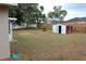 Backyard with a storage shed and a fenced in yard at 1550 Maxwell Ln, Deltona, FL 32738