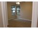 Bedroom featuring cozy carpet, neutral walls, a ceiling fan, and a view to the backyard at 1550 Maxwell Ln, Deltona, FL 32738