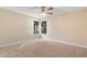 Spacious bedroom with plush carpet and natural light from two windows at 1550 Maxwell Ln, Deltona, FL 32738