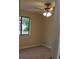 Bright bedroom with a ceiling fan and large window offering a view of the outdoors at 1550 Maxwell Ln, Deltona, FL 32738