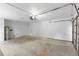 An empty garage with white walls and a concrete floor waiting for your customization at 1550 Maxwell Ln, Deltona, FL 32738