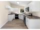 Kitchen with stone counters, stainless appliances, and ample cabinet space at 1550 Maxwell Ln, Deltona, FL 32738