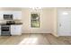 Eat-in kitchen boasts modern appliances and large window at 1550 Maxwell Ln, Deltona, FL 32738