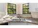 The large kitchen sink features double basin and two windows looking out to the garden at 1550 Maxwell Ln, Deltona, FL 32738