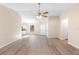 Bright, open-concept floor plan with wood-look floors and neutral paint at 1550 Maxwell Ln, Deltona, FL 32738