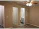 Main bedroom with ceiling fan, walk-in closet, and ensuite bathroom at 1550 Maxwell Ln, Deltona, FL 32738