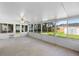 Enclosed sunroom with tile flooring, ceiling fan, and lots of natural light at 1550 Maxwell Ln, Deltona, FL 32738