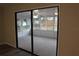 Sunroom with sliding glass doors connecting to the main house, offering backyard views at 1550 Maxwell Ln, Deltona, FL 32738