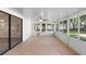 Enclosed sunroom with tile flooring and windows to enjoy the view of the backyard at 1550 Maxwell Ln, Deltona, FL 32738