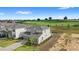 Aerial view of two-story home on golf course with manicured lawn at 16124 Volterra Pt, Montverde, FL 34756