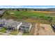 Aerial view of homes and a golf course in a residential community at 16124 Volterra Pt, Montverde, FL 34756