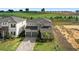 Aerial view of two-story home on golf course featuring a two car garage at 16124 Volterra Pt, Montverde, FL 34756