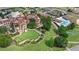 Aerial view of the property highlighting the meticulously manicured lawns and stone-clad architecture at 16124 Volterra Pt, Montverde, FL 34756