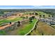 Expansive golf course with picturesque landscaping nestled alongside beautiful homes in a luxury community at 16124 Volterra Pt, Montverde, FL 34756