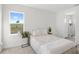 Bright bedroom features a queen bed, a large window with golf course views, and an en-suite bathroom at 16124 Volterra Pt, Montverde, FL 34756