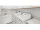 Clean laundry room featuring modern appliances and a sink, perfect for convenient chores at 16124 Volterra Pt, Montverde, FL 34756