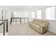 Bright loft with comfortable seating and modern railing overlooking the stairs at 16124 Volterra Pt, Montverde, FL 34756