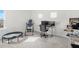 Bright office or flex space complete with gym equipment and desk setup for a functional and healthy lifestyle at 16124 Volterra Pt, Montverde, FL 34756