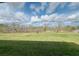 The backyard has a view of a beautiful wooded greenbelt and conservation area at 16436 Parable Way, Winter Garden, FL 34787