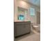 The bathroom features a vanity, toilet, and a shower/tub combination with tile surround at 16436 Parable Way, Winter Garden, FL 34787