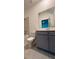 The bathroom has a toilet, tub with tile surround, and a gray vanity with a large mirror at 16436 Parable Way, Winter Garden, FL 34787
