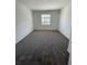 Bedroom showcasing neutral carpeting and a window providing natural light at 16436 Parable Way, Winter Garden, FL 34787