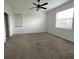 The bedroom features carpet, 2 windows, a ceiling fan, and a neutral color scheme at 16436 Parable Way, Winter Garden, FL 34787