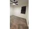 This bedroom features neutral carpet and a ceiling fan for added comfort and style at 16436 Parable Way, Winter Garden, FL 34787