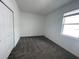 Cozy carpeted bedroom with a closet and one window, providing a simple and functional living space at 16436 Parable Way, Winter Garden, FL 34787