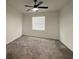 Bright bedroom with plush carpet and ceiling fan at 16436 Parable Way, Winter Garden, FL 34787