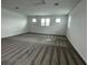 Spacious bonus room with plush carpeting, abundant natural light from the many windows at 16436 Parable Way, Winter Garden, FL 34787