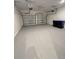 This two car garage features freshly painted walls and doors and ample space at 16436 Parable Way, Winter Garden, FL 34787