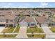 Aerial view of home with solar panels showing surrounding homes and neighborhood at 1693 Barberry Dr, Kissimmee, FL 34744