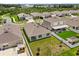 Spacious backyard with lush green grass, a covered patio, and a privacy fence, perfect for outdoor living at 1693 Barberry Dr, Kissimmee, FL 34744