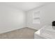 Neutral bedroom featuring plush carpeting and a window with horizontal blinds at 1693 Barberry Dr, Kissimmee, FL 34744