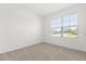 Bedroom featuring carpet, neutral walls, window, and natural light at 1693 Barberry Dr, Kissimmee, FL 34744