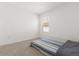 Cozy bedroom with a comfortable bed and a window providing natural light at 1693 Barberry Dr, Kissimmee, FL 34744