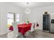 Dining area features modern lighting, a slider door to outside, and a wine fridge at 1693 Barberry Dr, Kissimmee, FL 34744
