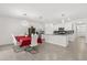 Bright and modern kitchen features white cabinets, stainless steel appliances, granite counters, and an island with pendant lighting at 1693 Barberry Dr, Kissimmee, FL 34744
