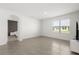 Bright living room with tile flooring, ample natural light, and a view into the bedroom at 1693 Barberry Dr, Kissimmee, FL 34744