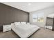Main bedroom with stylish wall, carpet, a modern mirror, and a window with a view at 1693 Barberry Dr, Kissimmee, FL 34744