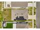 Aerial view showcases roof with solar panels, a well maintained yard, and proximity to neighborhood street at 1693 Barberry Dr, Kissimmee, FL 34744