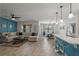 Spacious living room featuring a comfortable sectional sofa, modern ceiling fan, and sun-lit dining area at 1836 Partin Terrace Rd, Kissimmee, FL 34744