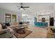 Open concept living space with kitchen island and a comfortable seating area at 1836 Partin Terrace Rd, Kissimmee, FL 34744