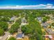Aerial view of a neighborhood with mature trees and a view of the horizon at 1913 S Summerlin Ave, Sanford, FL 32771
