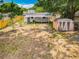 Backyard with a storage shed and a fence for privacy, offering space for outdoor activities and gardening opportunities at 1913 S Summerlin Ave, Sanford, FL 32771