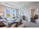 This spacious main bedroom features abundant natural light and is complemented by stylish decor at 1977 Walnut Creek Dr, Kissimmee, FL 34744