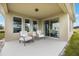 Inviting patio featuring comfortable seating and views of the surrounding landscape at 1977 Walnut Creek Dr, Kissimmee, FL 34744