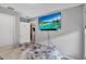 Cozy bedroom features a TV and neutral tones that fills the space with natural light at 208 Summerlin Ln, Haines City, FL 33844